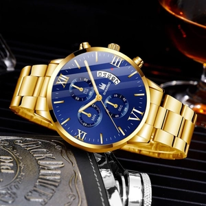 Detailed macro view of the gold business watch with blue dial and roman numerals