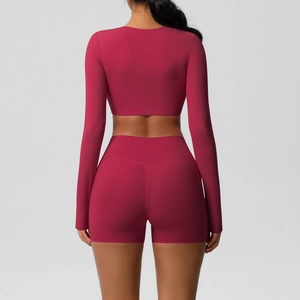Rear view of berry red high-stretch yoga set with long sleeve crop top and sports shorts