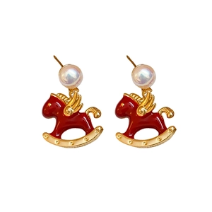Elegant red enamel rocking horse earrings with pearls and gold wing accents