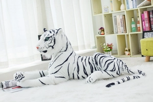 Detailed view of lifelike white tiger plush toy with realistic black stripes and green eyes