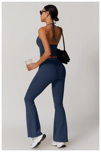 Detail view of navy blue halter yoga set featuring high-waisted flare leggings and sports top