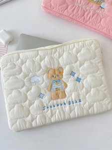 Quilted off-white laptop sleeve featuring cartoon bear embroidery and 13-14 inch laptop fit