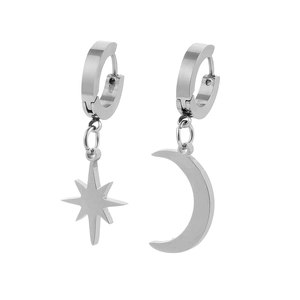 Detail of asymmetric silver hoop earrings featuring celestial star and moon pendants