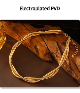 Detail of multi-layer golden snake chain necklace with PVD plating on wood background