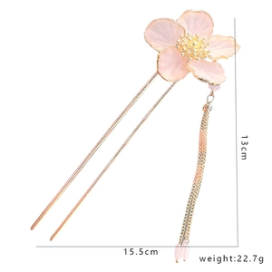 Detail showing pink flower tassel hair pin with 15.5cm length on white background