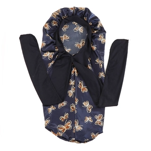 Detail of navy blue satin bonnet featuring gold butterfly print and long black ribbons