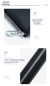 Detail of premium silver metal zipper and black pebble grain leather on long wallet
