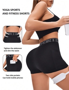 Detail of high waist seamless sports shorts with pockets and SPORTS logo waistband