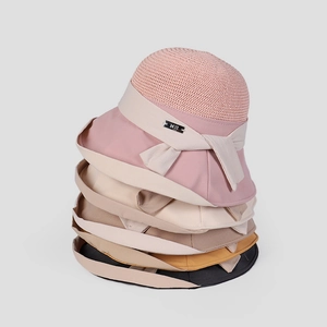 Stack of elegant women's breathable sun hats with patchwork design in various colors