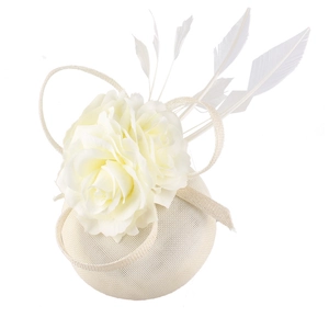 Macro detail of ivory fascinator hat with elegant fabric flowers and delicate feathers