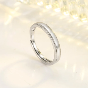 Polished silver adjustable open ring with delicate milgrain edge design for couples