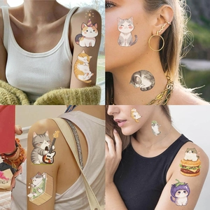 Detailed views of cute watercolor cat temporary tattoos applied on skin for parties