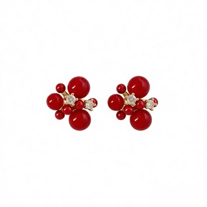 18K gold-plated cluster stud earrings featuring red spheres and sparkling clear zircons