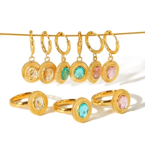 Retro gold sunburst earring and ring set featuring colorful oval zircon stones