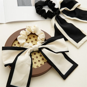 Elegant bow ribbon hair ties in black and white satin finish for women stylish ponytail