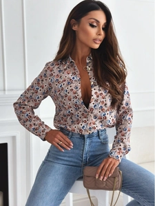 Close-up of floral long sleeve shirt with lapel collar and delicate pattern detail