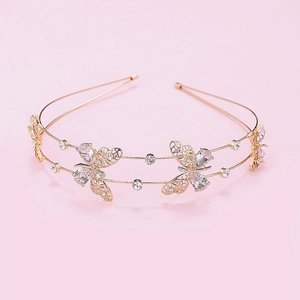 Elegant gold double-layer headband with hollow zircon butterflies on pink background