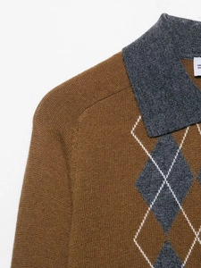 Close-up detail of argyle pattern and collar on the brown knitted polo sweater