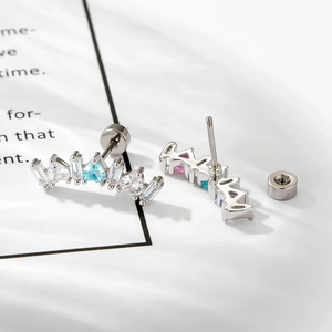 Silver crown ear stud with colorful cubic zirconia and screw back on a white background