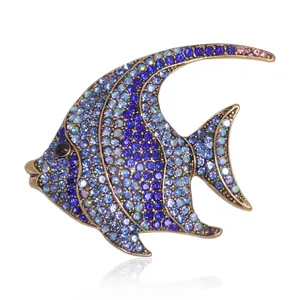 Elegant tropical fish brooch with blue crystals and sparkling rhinestones on gold base