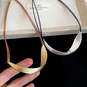 Minimalist matte metallic irregular pendant necklace set in gold and silver finish