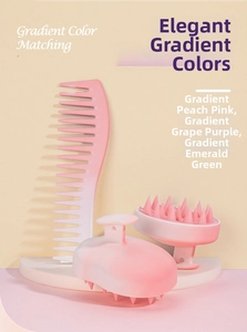 Detail of gradient peach pink scalp massager and wide tooth comb on a display pedestal
