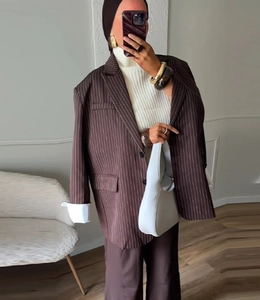 Mirror selfie showing an oversized dark brown striped blazer with loose casual fit