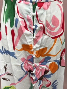 Detail of colorful floral print dress featuring white round buttons and polyester fabric