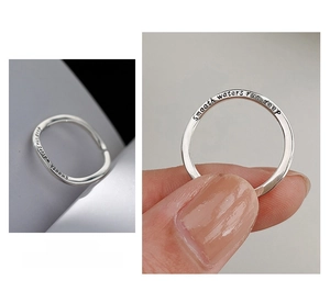 Detail of 925 silver wavy ring with Smooth waters run deep engraving and model shot