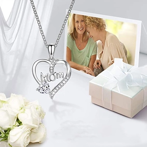 Silver heart necklace with MOM lettering and white zircon in a gift box with roses