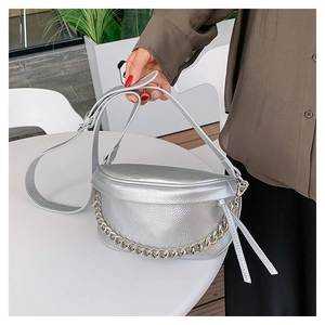 Close-up of silver lychee texture crossbody bag with stylish metal chain detail