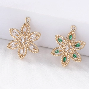 Retro flower pendants in gold plated copper with clear and green cubic zirconia