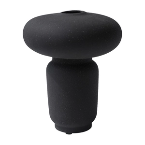 Vaso moderno in ceramica nera minimalista con trama opaca e design a forma di ciottolo