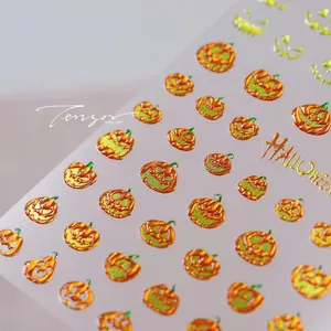 Detailed 3D embossed Halloween nail stickers featuring orange pumpkins and spooky designs