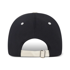 Rear view of minimalist black cotton baseball cap with white contrast adjustable strap