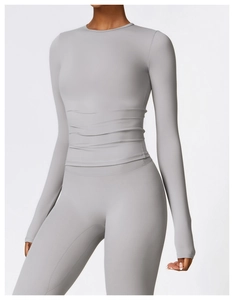 Close-up of light grey brushed long sleeve yoga top and high waist sports leggings