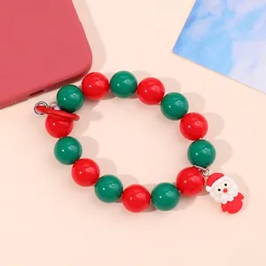 Christmas Santa Claus beaded phone charm strap with red and green pearls on a case