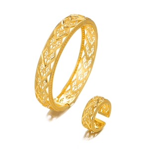 Luxury hollow gold-plated bracelet and ring set with intricate geometric floral designs