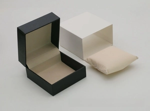 Detail of lychee textured leather watch box set with inner pillow and outer sleeve