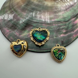 Three 18K gold-plated heart pendants with iridescent abalone shell and clear crystals