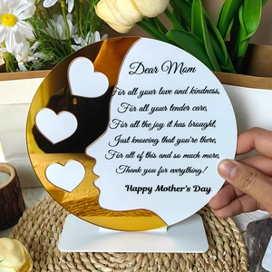Close-up of acrylic Mother's Day plaque with gold mirror heart cutouts and poem