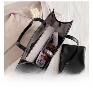 Detail view of large transparent tote bag interior showing capacity for daily essentials