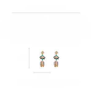 Detailed spec sheet showing 6.7cm bow earrings with alloy, crystal and faux pearl specs