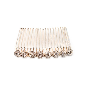 Golden hair comb featuring nine sparkling rhinestone flowers with 20 metallic comb teeth