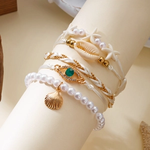 Bohemian 4pcs multilayer charm bracelet set with starfish seashell and evil eye pendant
