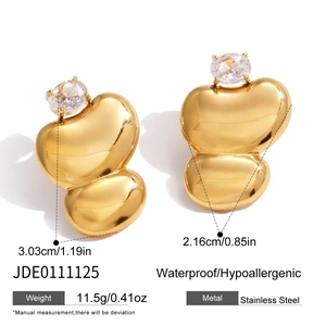 Detail view of egg-shaped gold earrings with zircon inlay showing 3.03cm size specs