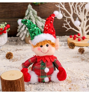Detailed view of Christmas elf plush doll with sequin hat and faux fur in holiday scene