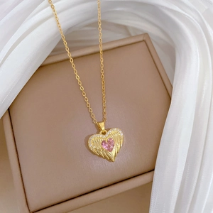Pink heart pendant with golden angel wings on a delicate necklace for women