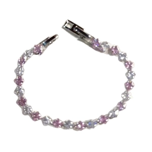 Elegant silver bracelet with alternating pink and clear zircon stones on a white background
