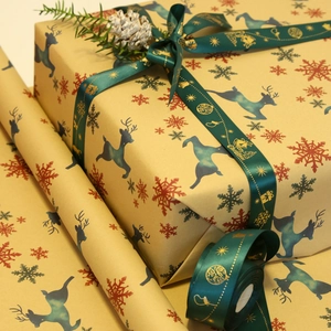 Christmas gift wrapping set with gold-stamped ribbons and reindeer kraft paper